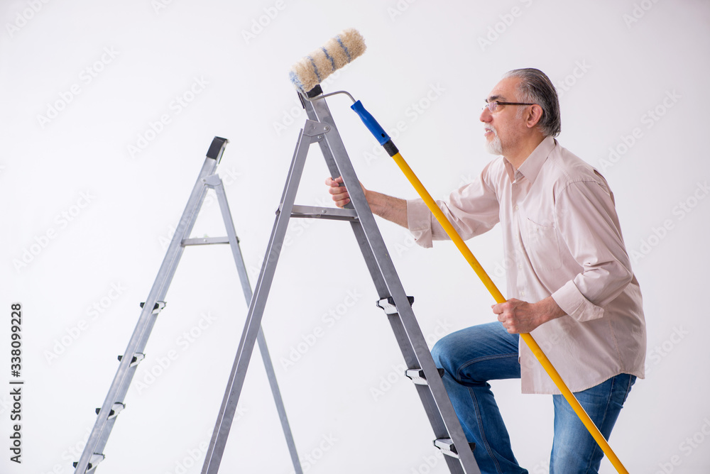 Old husband contractor in home renovation concept Old husband contractor in home renovation concept