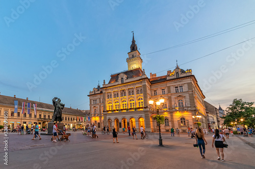 Novi Sad, Serbia July 30, 2019: Freedom Square (serbian: Trg slobode) is the main square in Novi Sad. The photo shows County government office (City house) and monument of Svetozar Miletic.