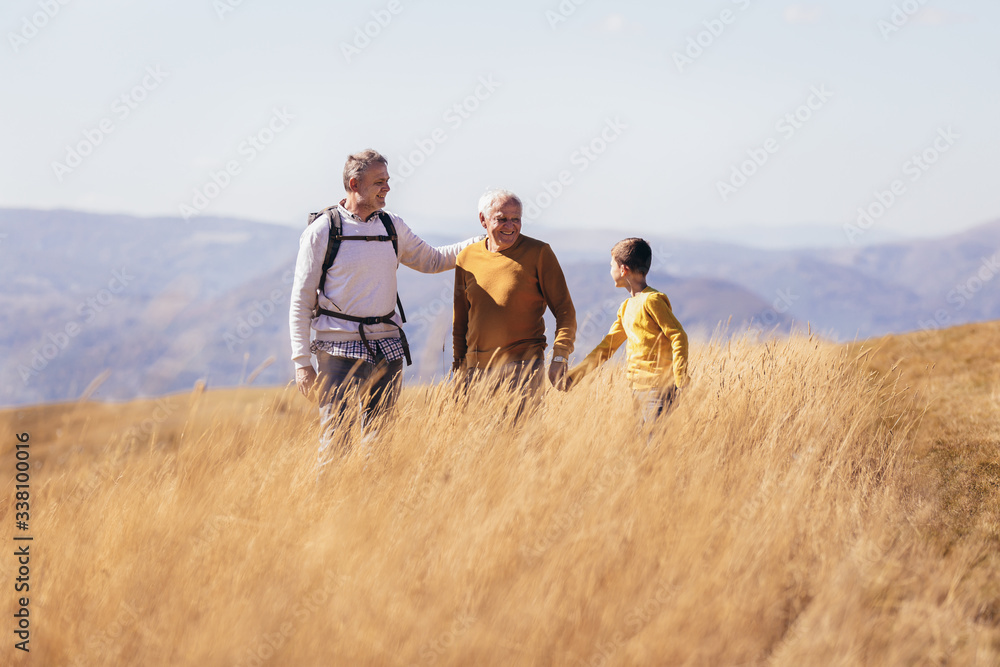 Three generations of family hiking together in the autumn. Three generations of family hiking together in the autumn.