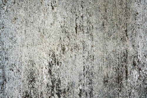 grey old concrete background. The old wall was streaked and scratched. structural spots are gray-white inclusions
