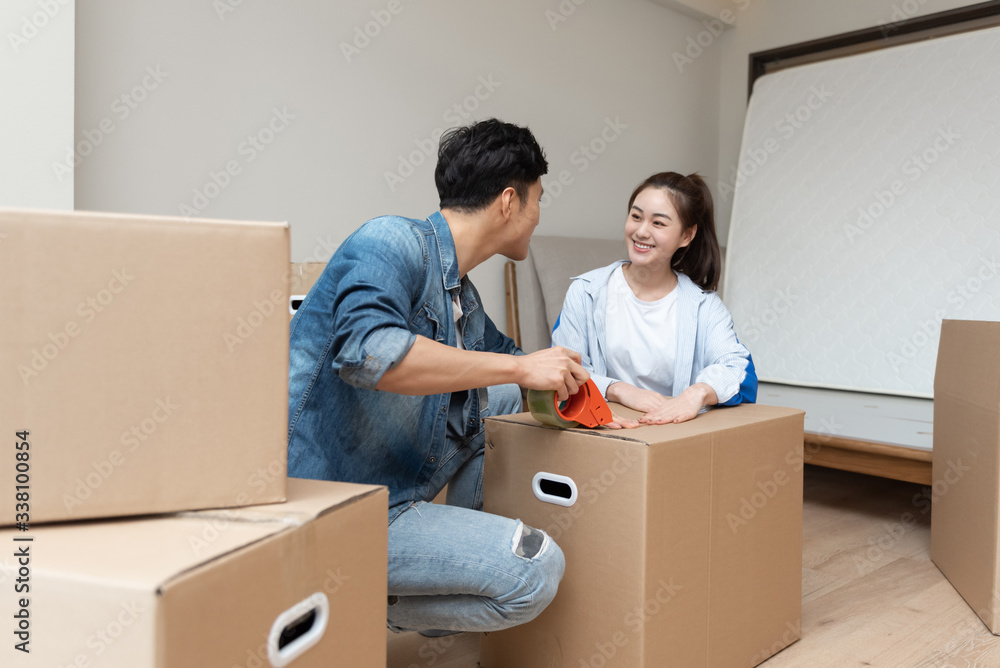 A young asian couple is moving to a new home A young asian couple is moving to a new home