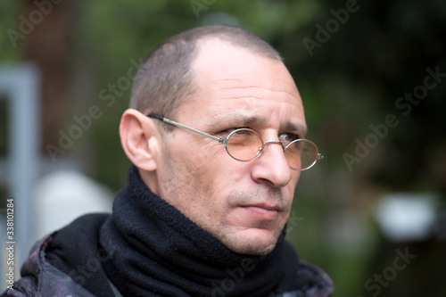 Close up portrait of a successful young guy. Outdoors on a sunny street