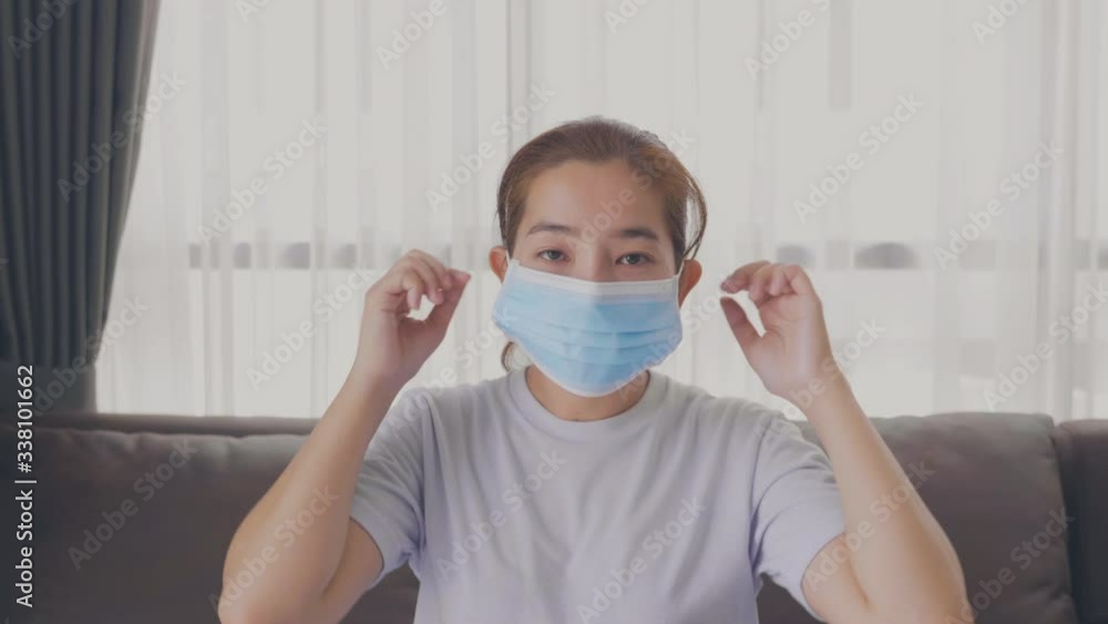 Coronavirus protection. Asian Woman wearing mask to avoid infectious diseases Healthcare concept to Covid-19 virus prevention at Home Coronavirus protection. Asian Woman wearing mask to avoid infectious diseases Healthcare concept to Covid-19 virus prevention at Home