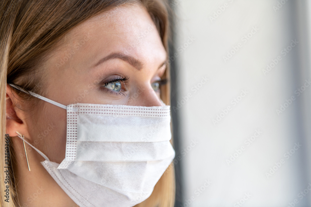 Nurse or doctor with face mask. Close up portrait of young caucasian woman model