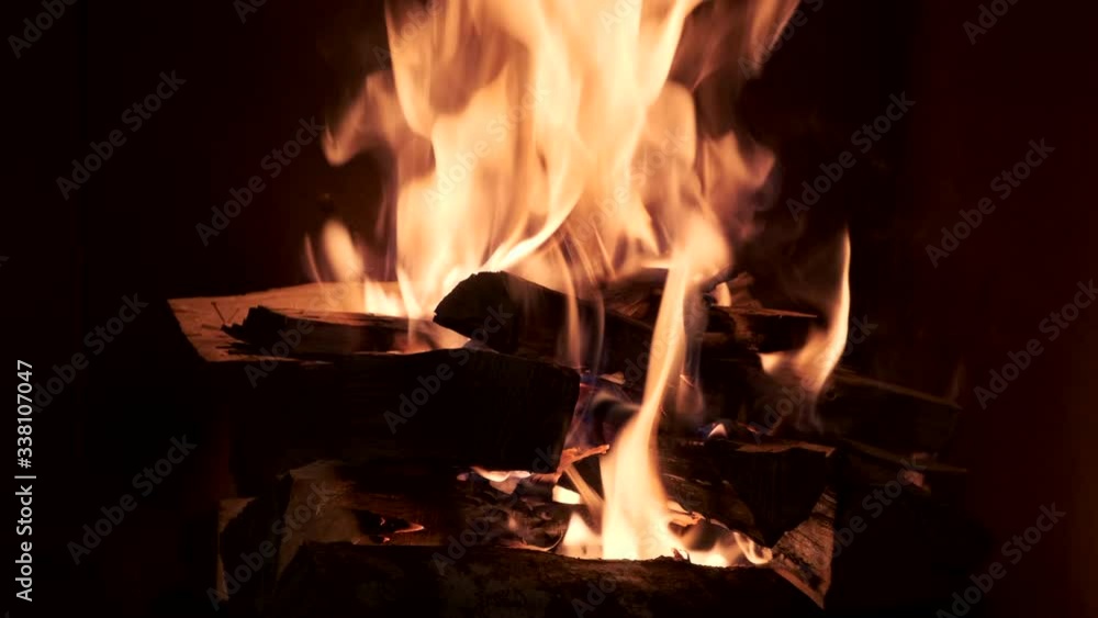 Closeup of burning fire in fireplace. Zoom out. Closeup of burning fire in fireplace. Zoom out.