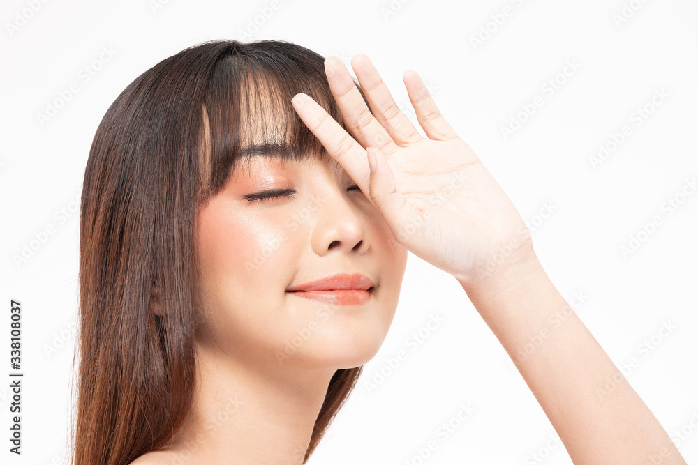 Beautiful Asian woman looking at camera hand up cover on face smile with clean and fresh skin Happy and cheerful with positive emotion on white background,Beauty Cosmetics and facial treatment Concept Beautiful Asian woman looking at camera hand up cover on face smile with clean and fresh skin Happy and cheerful with positive emotion on white background,Beauty Cosmetics and facial treatment Concept