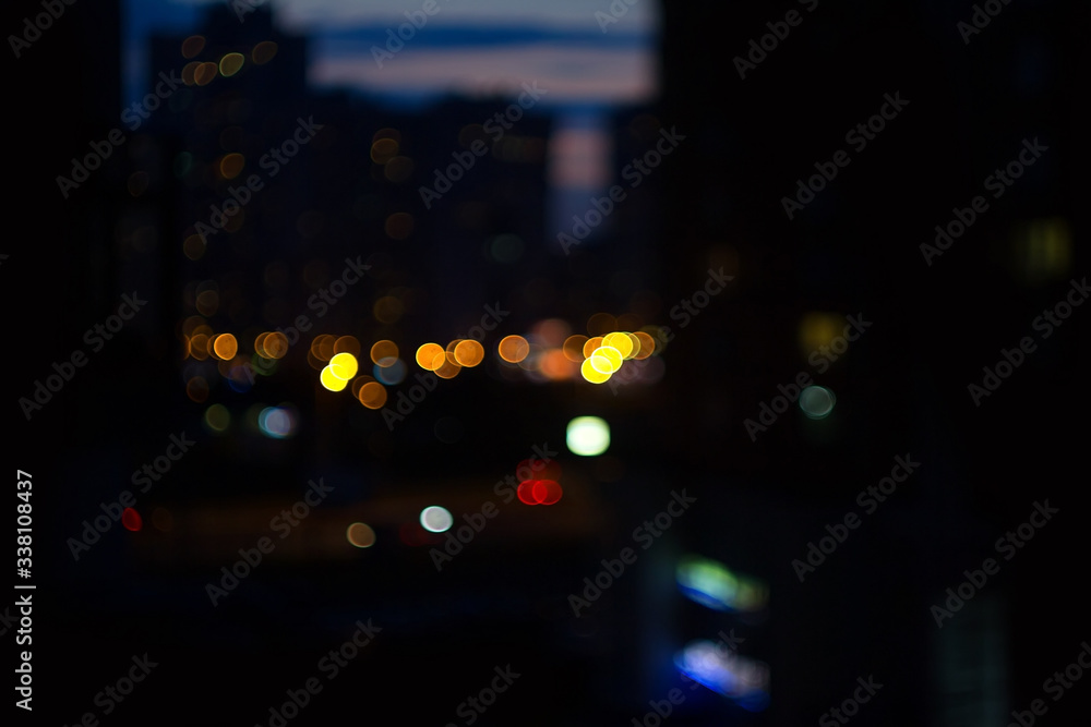 City night. Lights broke and blurred background. De focused urban street. Blur effect.