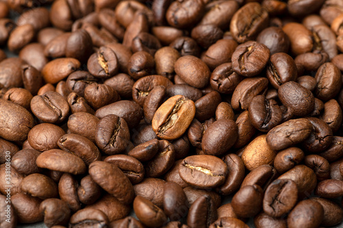 Coffee background. Roasted coffee beans on a dark background. Coffee banner for menu, design and decoration