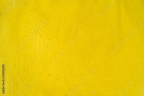 A beautiful Yellow paint texture on wall, background - Image. Color paint strokes.