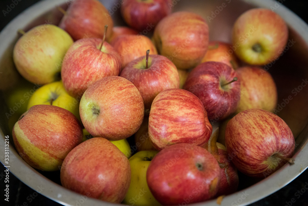 Stainless steel fruit bowl with very beautiful red apples. Stainless steel fruit bowl with very beautiful red apples.