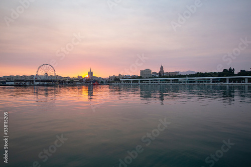 sunset landscape with the sea and buildings in the background