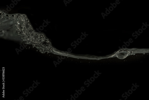 Bubbles on water surface with black background