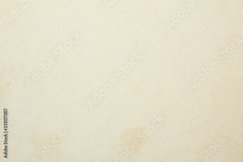 Old vintage beige sheet of drawing paper with dirty stains and spots on surface texture background. © Purple Moon