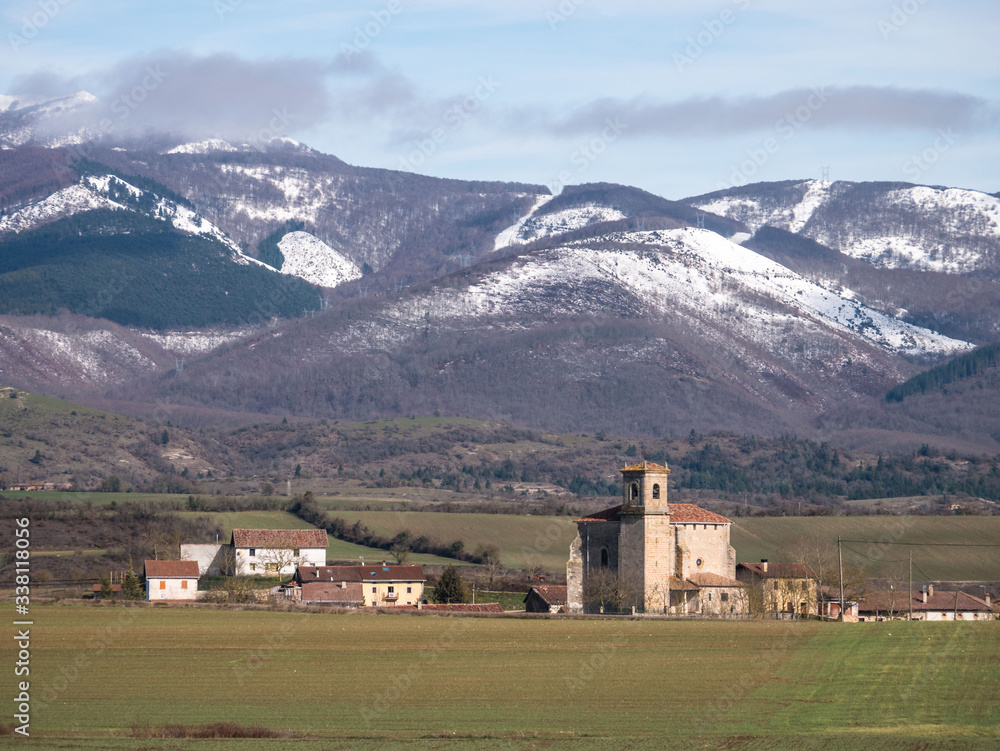 View of the village of Ordañana and the Aizkorri mountain range, Alavese Plains near Salvatierra, Basque Country, Spain