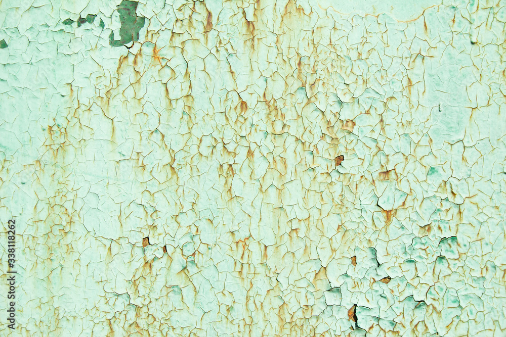 Old green painted metal surface with rust and   corrosion. Green dirty wall with cracked and peeling paint texture background.