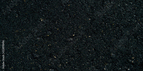 The texture of the black grunge asphalt Banner photo. The seamless texture of bitumen road asphalt.