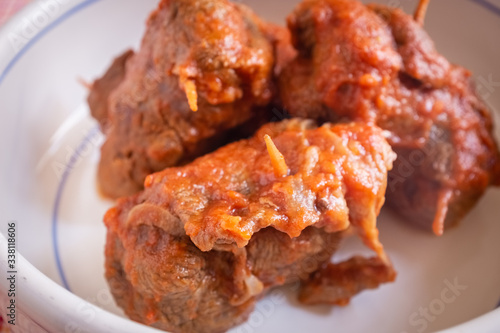 Delicious dish made of beef meat roll called braciola with tomato sauce. Apulia typical food. Italy