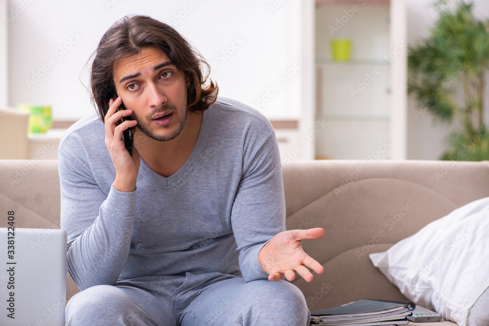 Young male employee freelancer working from home Young male employee freelancer working from home