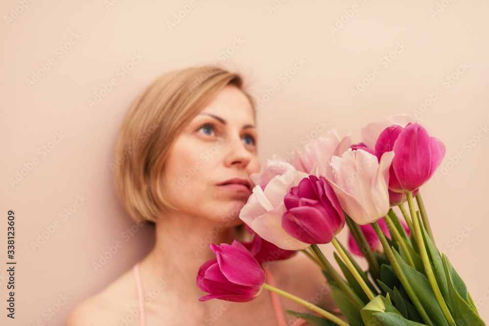 Woman with a bouquet of tulips at spring time
