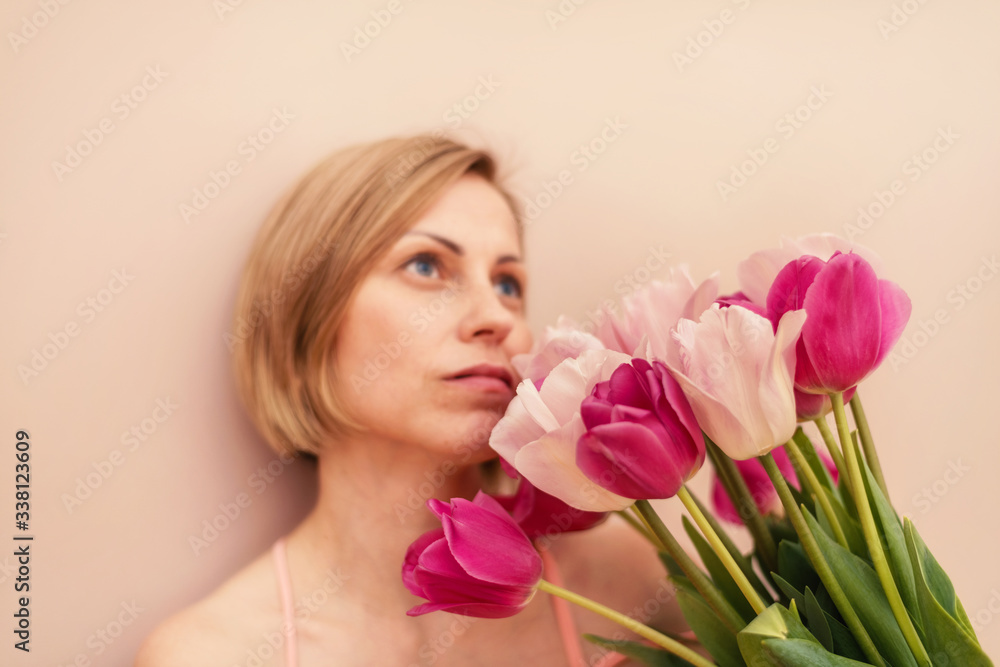 Woman with a bouquet of tulips at spring time Woman with a bouquet of tulips at spring time