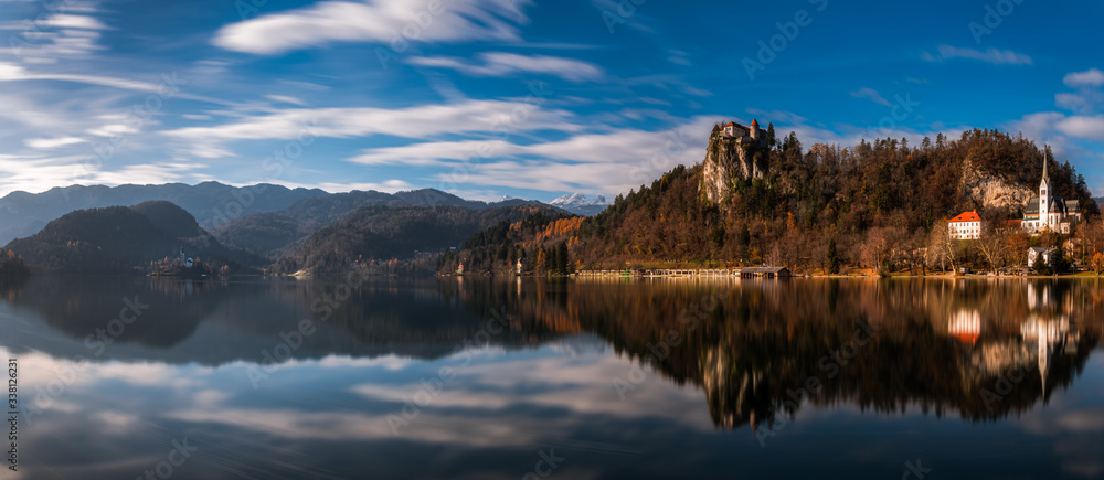 Long exposure panorama shot of the beautiful Lake Bled, Slovenia with the Bled Castle and the surrounding mountains