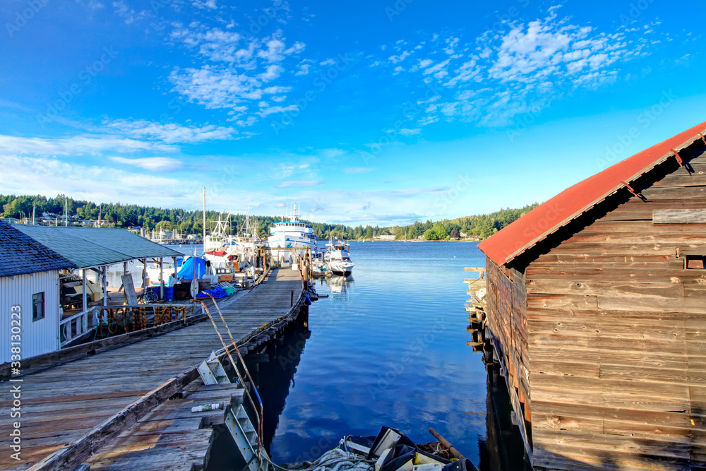 Fototapeta premium Gig Harbor downtown with water, boats, small town, buildings. State Washington, USA.