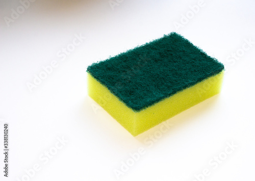 Yellow sponge on white background