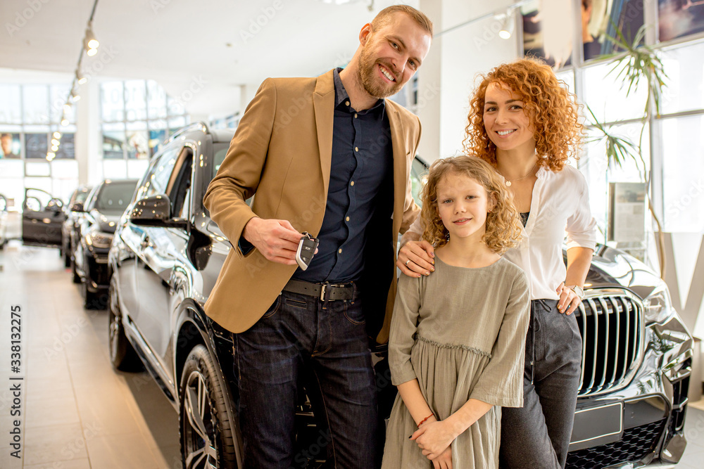 happy caucasian family came to get new automobile in dealership. cheerful people are future owners of perfect car, they make purchase in cars shop - obrazy, fototapety, plakaty 
