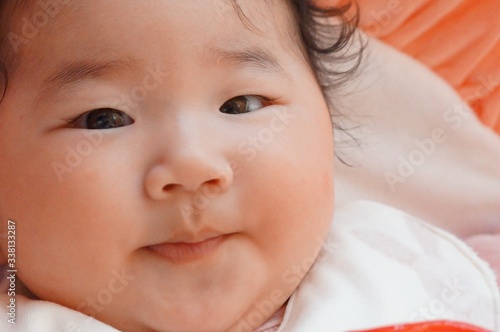 4 month old baby playing with O'ball.