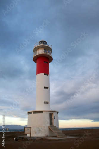 Lighthouse Fangar, in Tarragona, Spain, at sunset