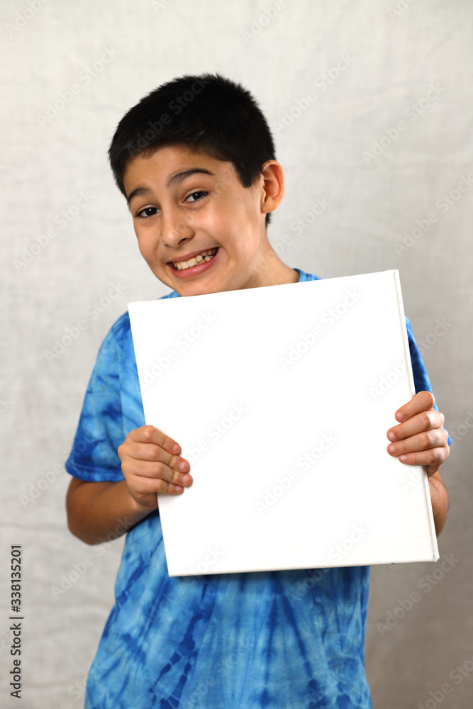 A boy holding a white board on a blue batik shirt on a white background, happy, sad, smiley, 