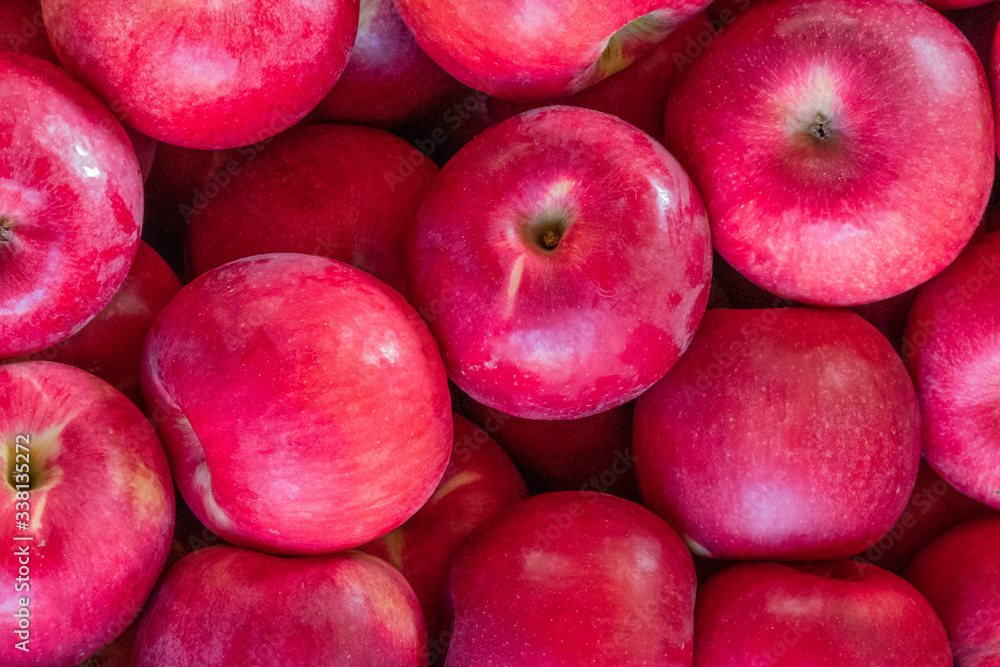 Multi-colored apples in a box. Selling crops on the market. Natural, healthy, vitamin-rich foods. Food for health. A variety of types of apples: yellow, red, green, variegated, with dots. Multi-colored apples in a box. Selling crops on the market. Natural, healthy, vitamin-rich foods. Food for health. A variety of types of apples: yellow, red, green, variegated, with dots.