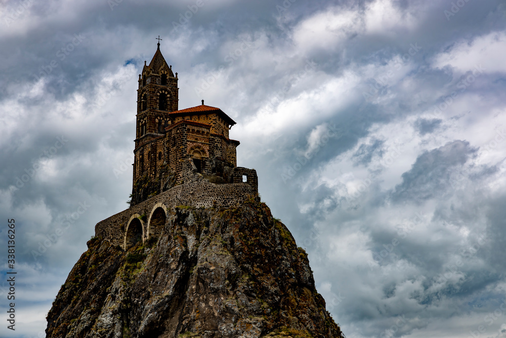 Saint-Michel d' Aiguilhe rock with the Chapel in Puy-en-Velay town. Haute-Loir, Auvergne-Rhone-Alpes region in France.