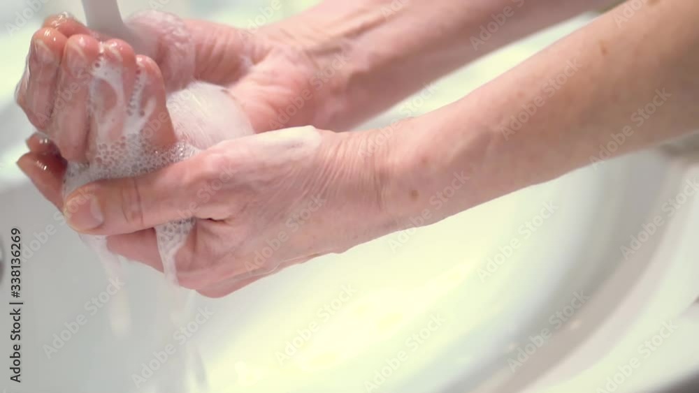 Good hand hygiene technique. Protect yourself from germs and the Covid19 coronavirus. Careful and prolonged soaping and washing off of hands. Good hand hygiene technique. Protect yourself from germs and the Covid19 coronavirus. Careful and prolonged soaping and washing off of hands.