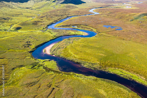 Aerial View over Scenic River in Scottish Highlands