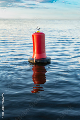 Warning red buoy in the ocean