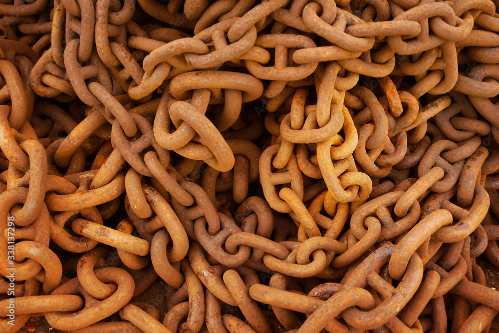 Thick rusty steel chains placed together Thick rusty steel chains placed together
