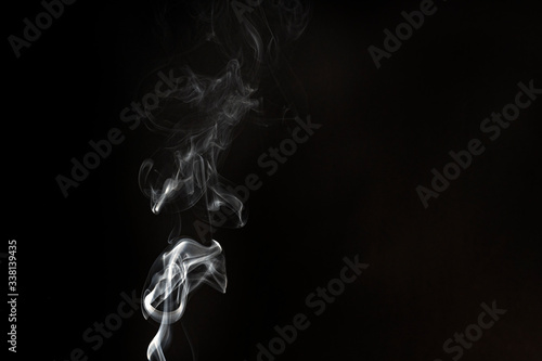 White smoke on a black background. Copy space
