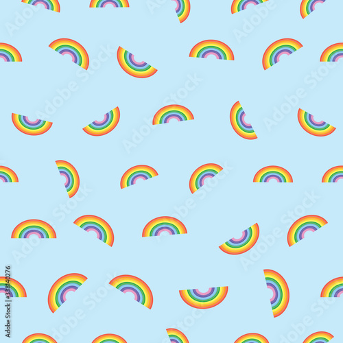 Scattered rainbow on blue background. Pattern for fabric, wrapping, textile, wallpaper, apparel. Vector illustration
