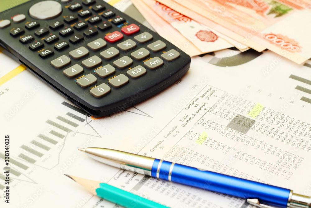 Business concept with a report and a calculator Business concept with a report and a calculator