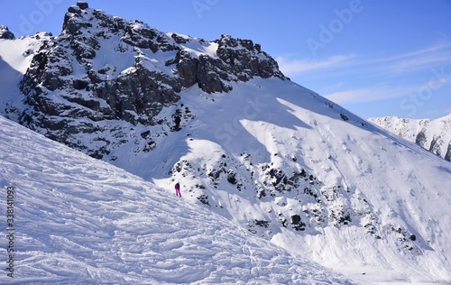 Extreme skier on a steep mountainside. Winter landscape