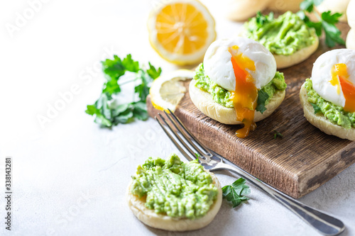 Fresh Homemade English Muffins with Avocado and Egg. Breakfast, morning concept.