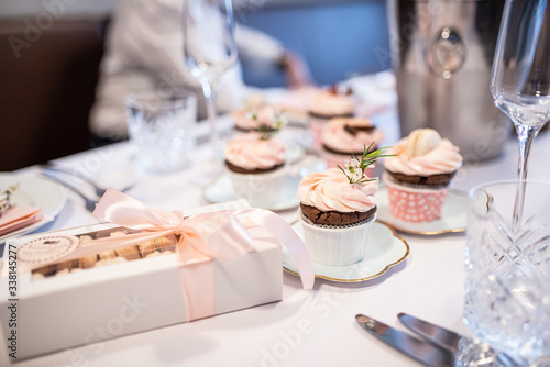 Beautiful table set for an event party or wedding reception . restaurant interior cakes on table