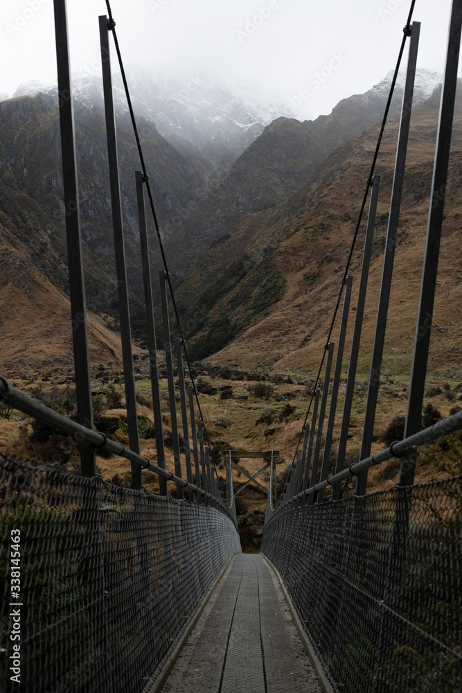 Obraz premium Snow peak with bridge in south island, Wanaka, New Zealand. Photograph in winter 2019.