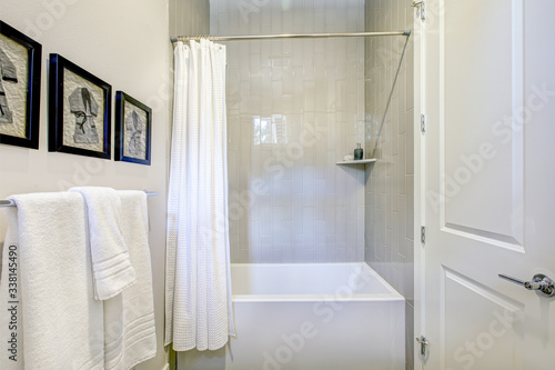 Fototapeta Naklejka Na Ścianę i Meble -  White and grey bathroom interior with a shower. Luxury American modern home.
