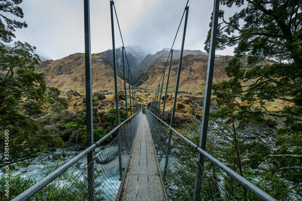 Obraz premium Snow peak with bridge in south island, Wanaka, New Zealand. Photograph in winter 2019.