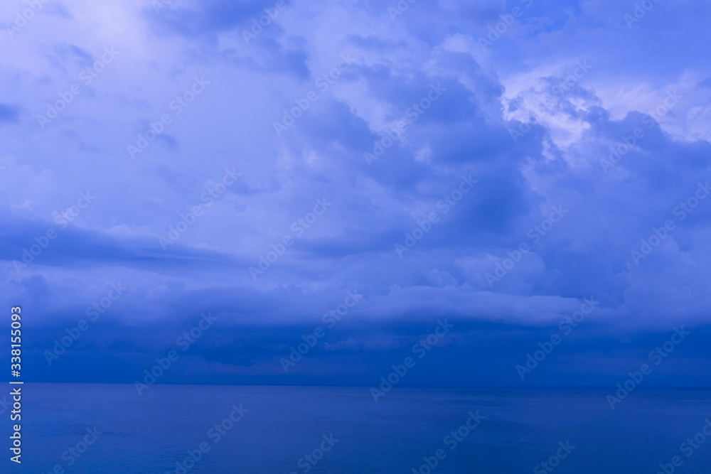 Waves and clouds. Blue ocean Beautiful sunset at Balangan Beach on the island of Bali in Indonesia. Surfers catch the waves, tourists relax and enjoy the sunset or sunrise