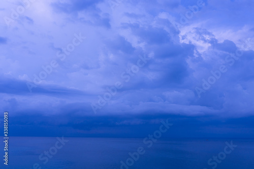 Waves and clouds. Blue ocean Beautiful sunset at Balangan Beach on the island of Bali in Indonesia. Surfers catch the waves, tourists relax and enjoy the sunset or sunrise