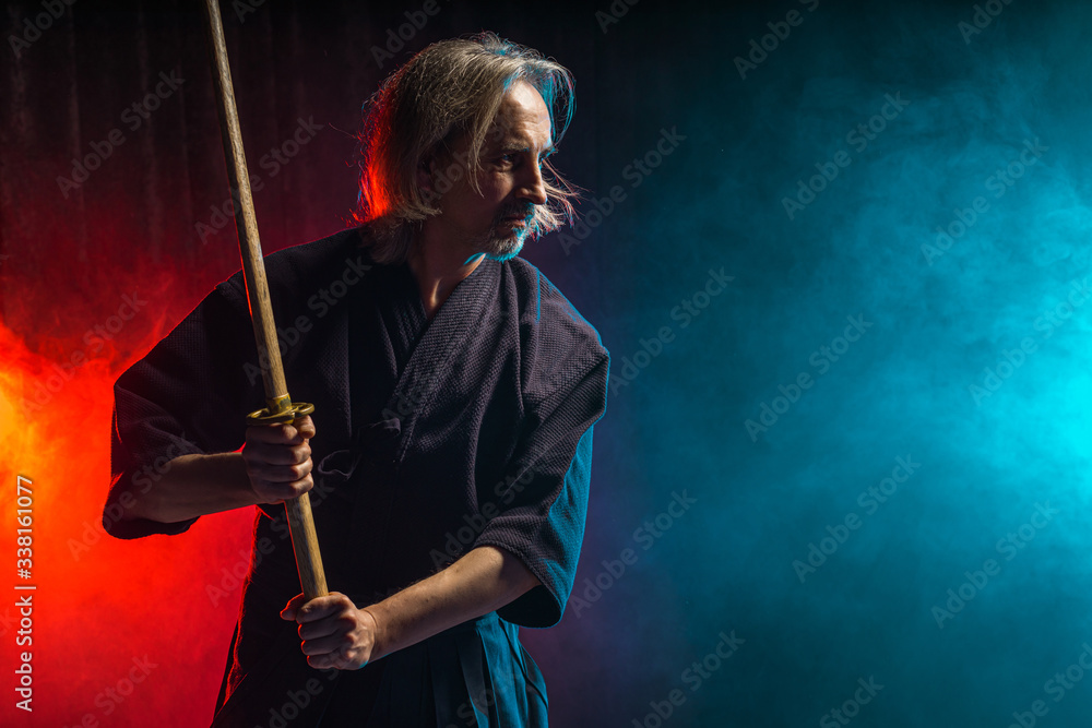 Perceptible colegio Diplomático portrait of caucasian strong man kendo fighter with bokuto. kendo warrior  male holding samurai sword katana Stock 写真 | Adobe Stock