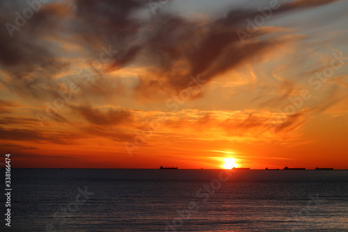 Beautiful photo of a bright sunset on the sea © tanor27